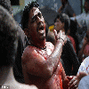 Blood is seen on the floor of a mosque as Indian Shiite Muslims flagellate themselves during a holy procession.