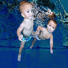 By Emily AndrewsThey are too young to walk and talk but tiny twins William and Ellenita Trykush can swim a length of a 25-metre pool at just nine months old.The water babies love gliding up and down on their backs, kicking their legs to propel themselves along.And as this delightful underw