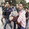 The perils of wearing low-slung jeans: Rock-slinging protester caught with his pants down as Egypt is rocked by fresh violence